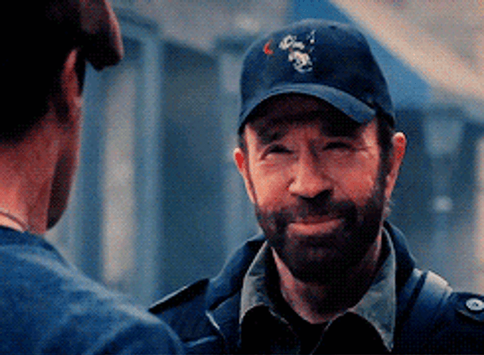 Chuck Norris Smiling To Sylvester In Expendables GIF