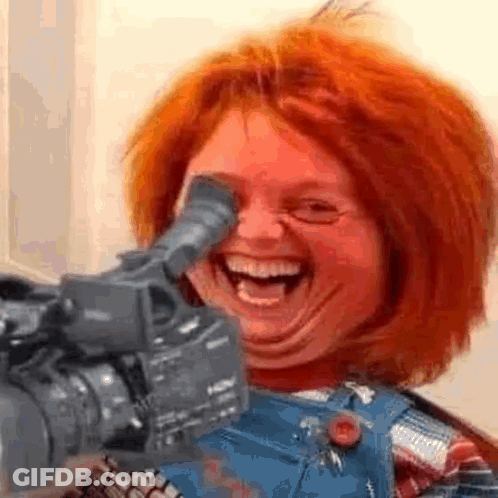 Chucky Doll Laughing Holding Camera GIF
