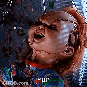 Chucky Holding Scissors With Mouth Open GIF