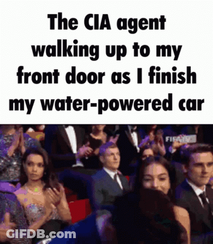 CIA Agent Walking To Front Door While Finishing Water-Powered Car GIF