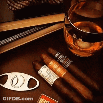 Cigar Cutter Next To Cigars GIF