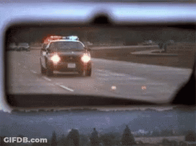 Cinematic Police Car Chasing Rear View Mirror GIF