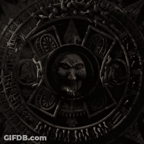 Circular Stone Carving With Face GIF