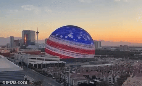 City Aerial View With American Flag Sphere GIF
