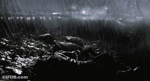City At Night With Green Light From Sky GIF