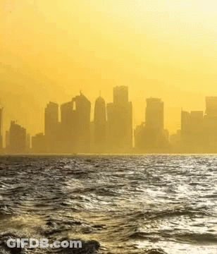 City Skyline Over Water GIF