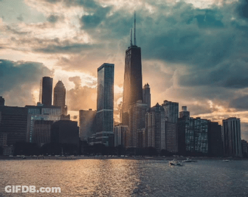 City Skyline With Boats In Water GIF