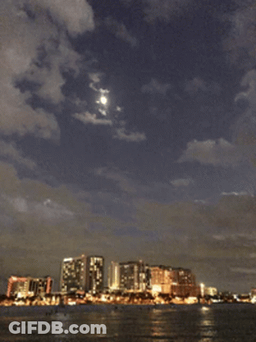 City Skyline With Full Moon GIF