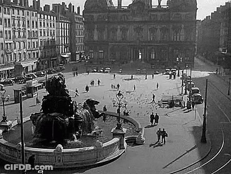 City Square With Fountain And People GIF