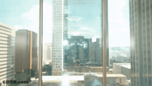 City View Through Window With Sun Shining GIF
