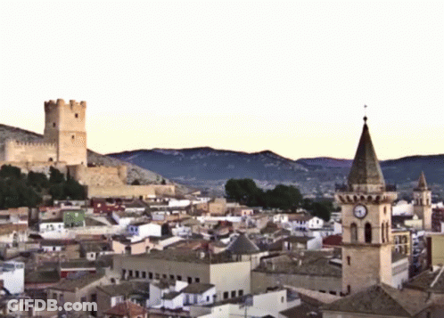 Cityscape With Clock Tower And Castle GIF