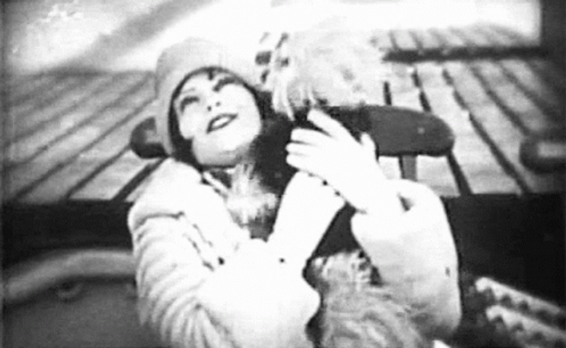 Clara Bow Hugging A Dog GIF