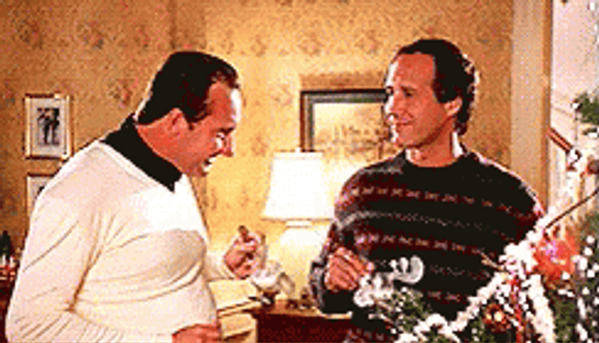 Clark Griswold Sipping And Sharing Stories GIF