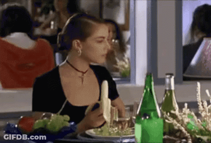 Classy Woman Eating Banana GIF