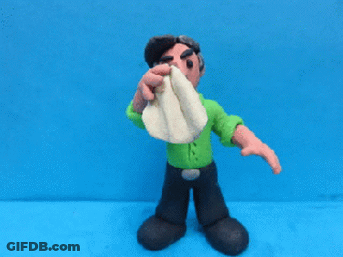 Clay Man In Green Shirt Wiping Nose With Towel GIF
