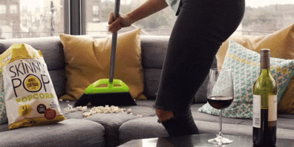 Cleaners Sweep The Living Room's Mess GIF