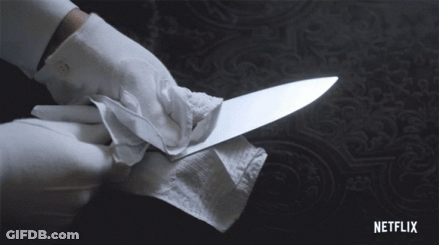 Cleaning A Knife With Tissue Paper GIF