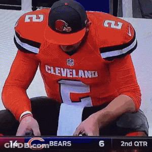 Cleveland Football Player Sitting On Bench GIF