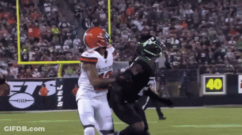Cleveland Jersey Player Tackled By Black Jersey GIF