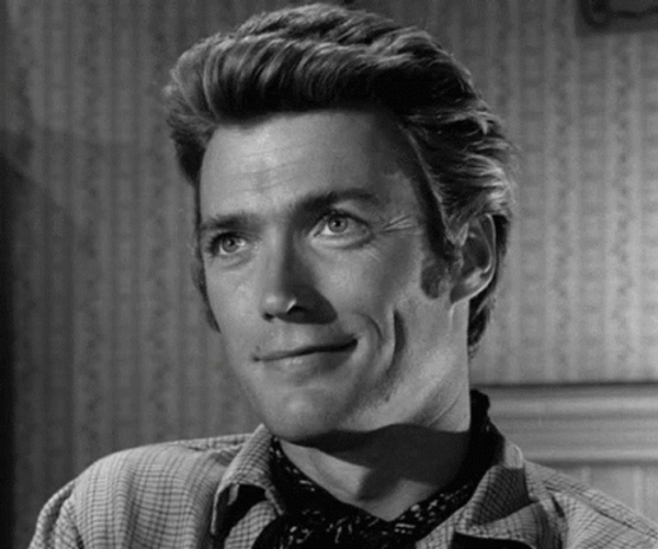 Clint Eastwood Laughing Smile GIF