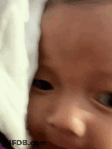 Close Up Baby Face With White Blanket GIF