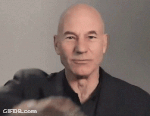 Close Up Bald Man In Black Shirt And Jacket GIF