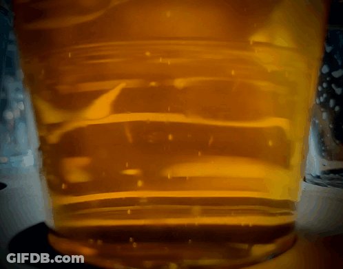Close Up Beer Glass With Bubbles GIF