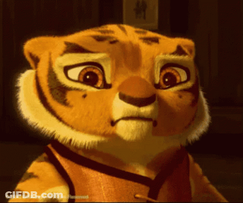 Close Up Cartoon Tiger Face With Copyright Watermark GIF