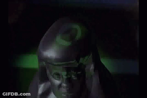 Close Up Face In Camouflage Uniform In Dark GIF