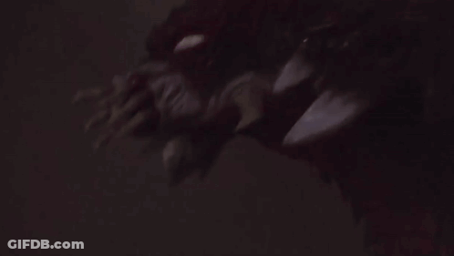 Close Up Face In Dark Room GIF