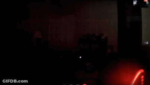 Close Up Face In Dark Room GIF