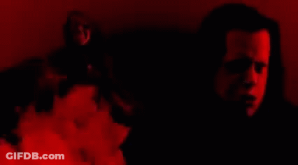 Close Up Face Surrounded By Flames GIF