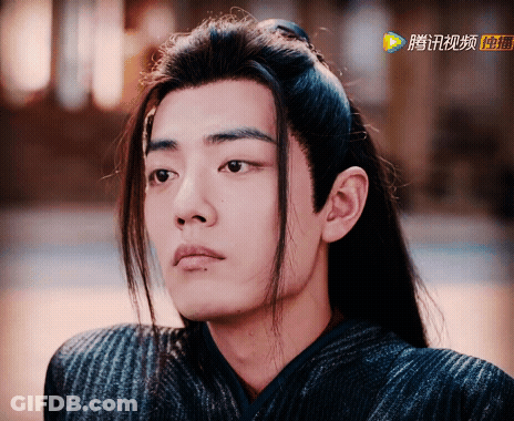 Close Up Face With Chinese Writing GIF