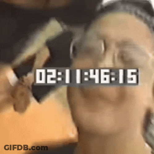 Close-Up Face With Clock Saying 02:11:46:15 GIF