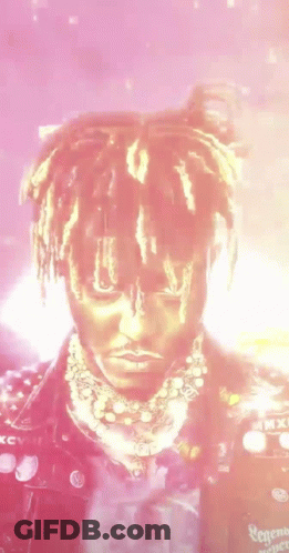 Close-Up Face With Dreadlocks And Necklace GIF