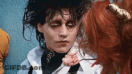Close Up Face With Flower In Mouth GIF