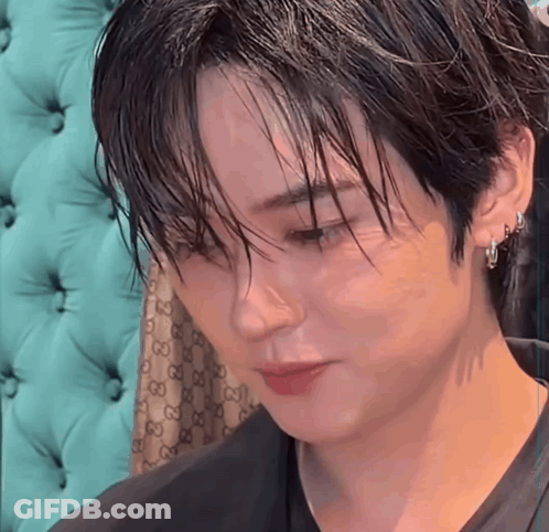 Close Up Face With Gucci Pattern On Couch GIF