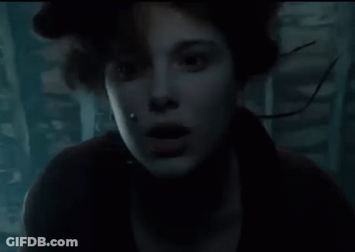 Close Up Face With Water Coming Out In Dark Room GIF