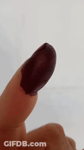 Close Up Finger With Black Paint GIF