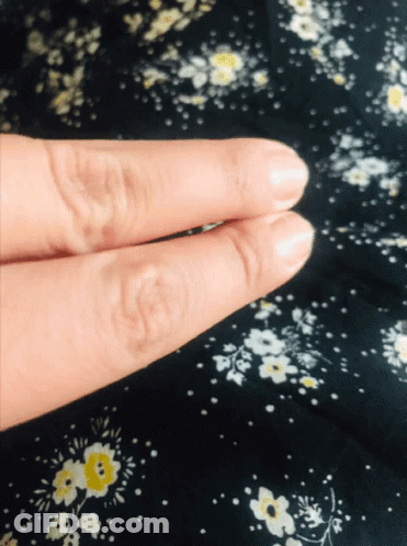 Close Up Fingers Black Floral Background GIF