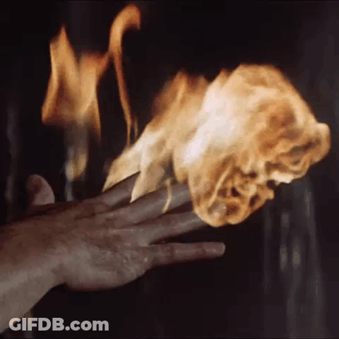 Close Up Hand Holding Torch In Dark Room GIF
