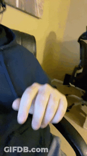 Close-Up Hand In Black Shirt GIF