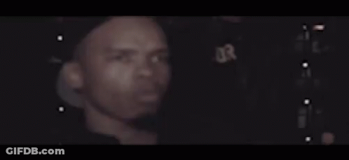Close Up Man Face Dark Room Lights Behind GIF