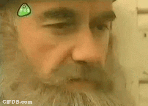 Close Up Man Face With Green Sticker GIF