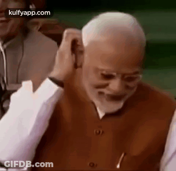 Close-Up Man's Ear And Hand GIF