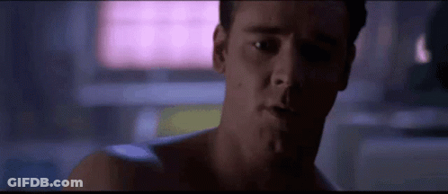 Close Up Man's Face Pink Background GIF