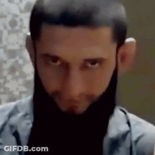 Close Up Man's Face With Black Beard GIF