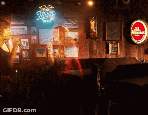 Close Up Man's Face With Red Light In Dark Room GIF