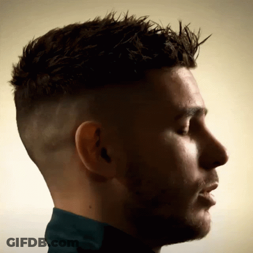Close Up Man With Eyes Closed And Ear Tattoo GIF