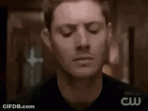 Close Up Man With Eyes Closed In Dark Room GIF